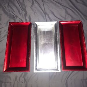 Three metallic trays